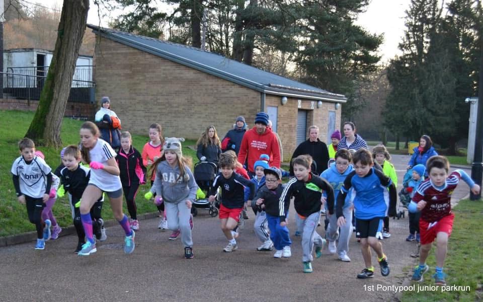 young runners cross a start line