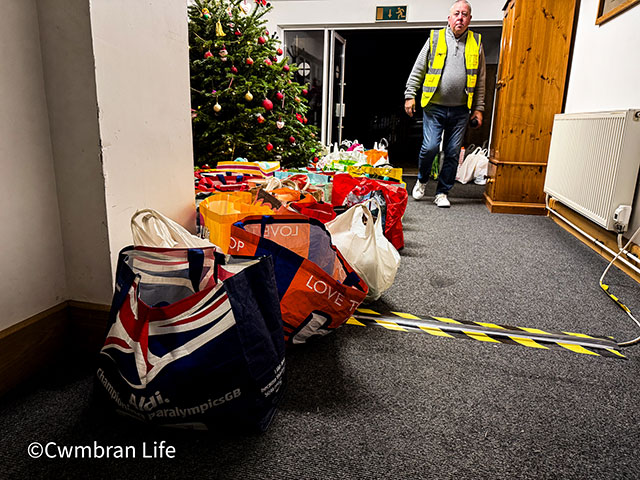 dozens of bags of food ready to be collected