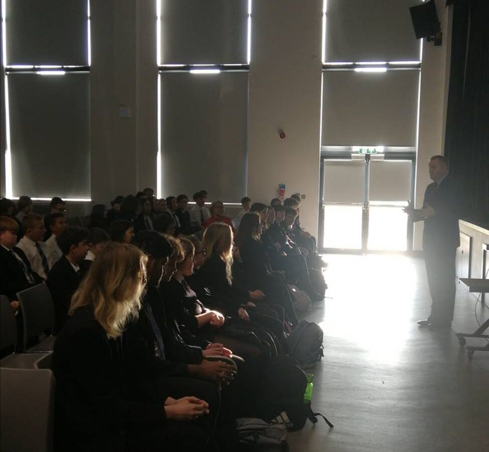 Nick Thomas-Symonds MP talking to a school hall of pupils