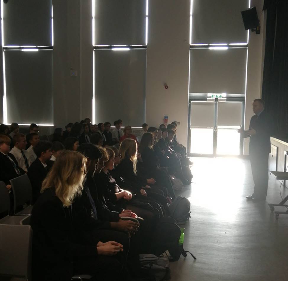 Nick Thomas-Symonds MP talking to a school hall of pupils