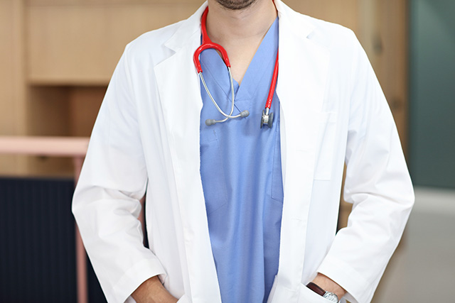 a doctor with hands in pockets