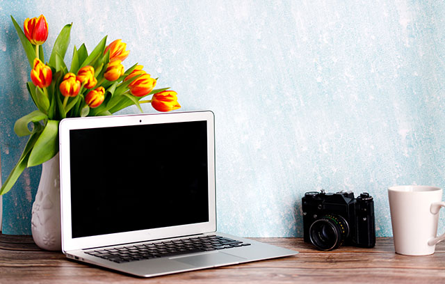 Minimal home desktop with coffee mug, and old camera