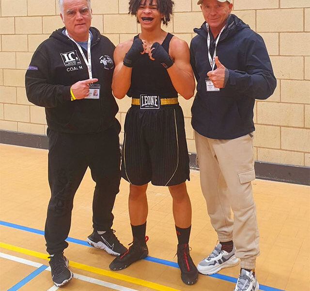 a boxer with two of his coaches