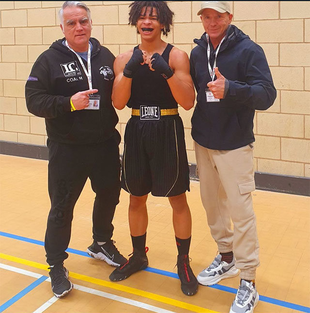 a boxer with two of his coaches