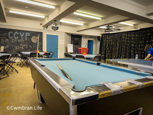 a pool table in large hall