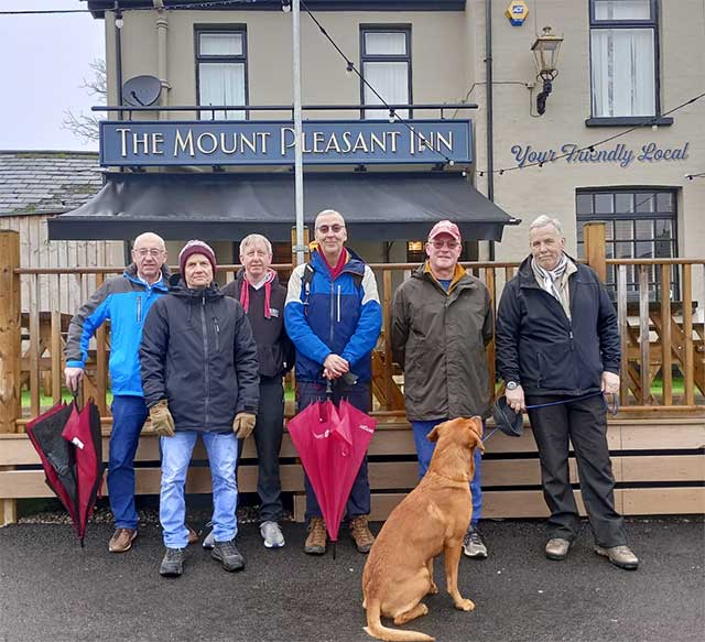 six men and a dog outside the Mount Pleasant pub