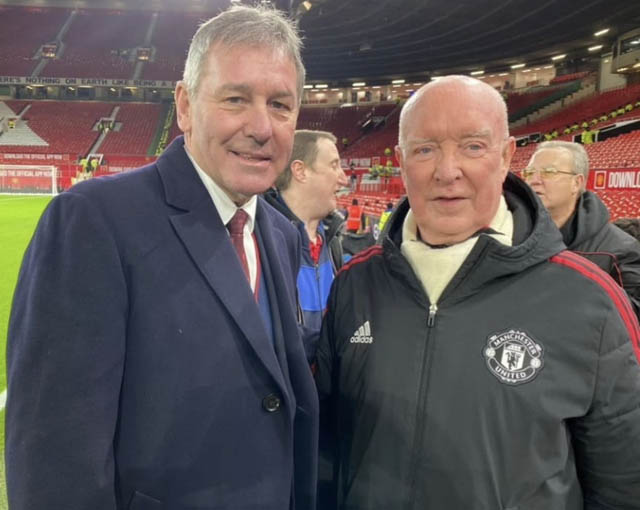 bryan robson, footballer, and steve doolan on the pitch at old trafford