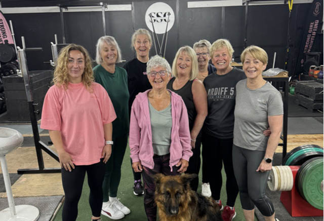 a group of women in a gym