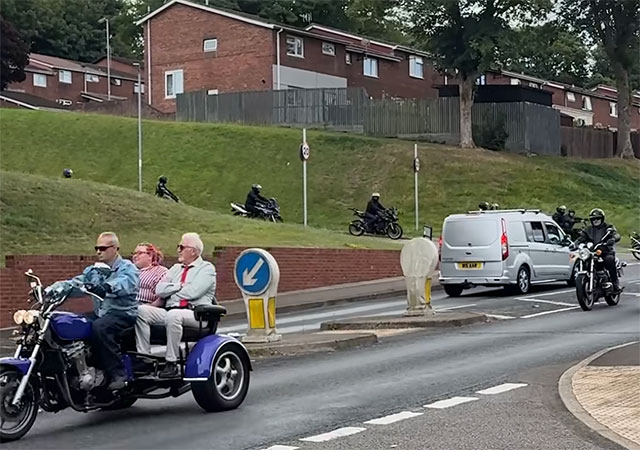 a group of bikers on road
