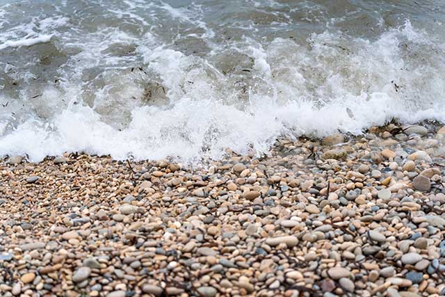waves lap on a rocky beach