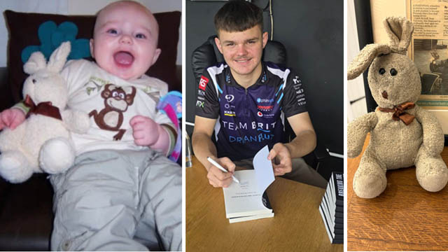 caleb signs a book and a photo of him as a baby holding a toy bunny