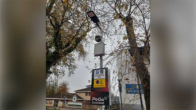 a cctv camera in a car park