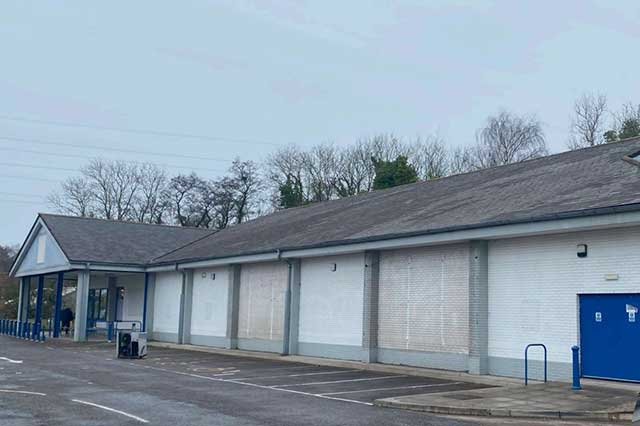 A former supermarket- now boarded up
