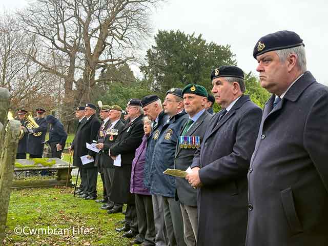 a row of veterans in a line for a memorial service