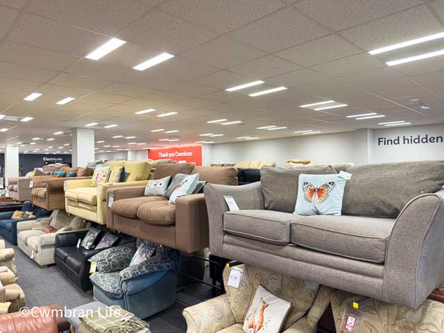 rows of sofas in a large room