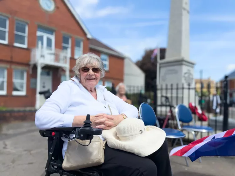 a woman by a war memorial