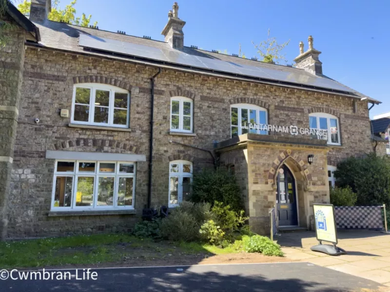 a large brick building with the text Llantarnam Grange on it