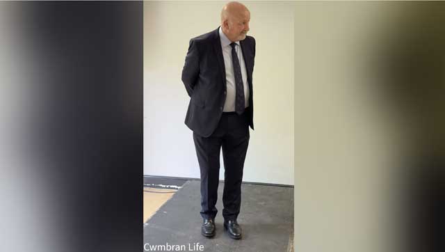 a man stood in a suit