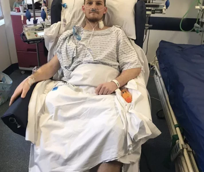 a man in a hospital bed