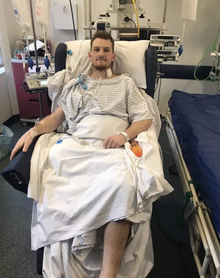 a man in a hospital bed