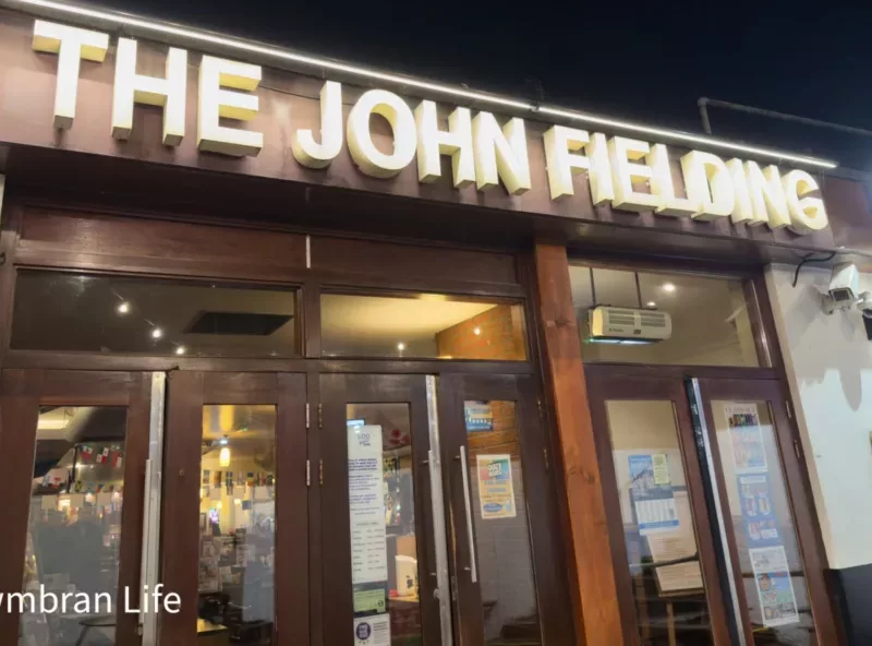 the entrance to a pub called The John Fielding