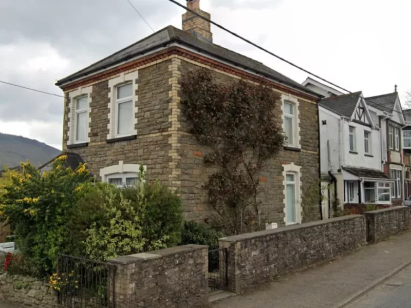 a house with a road running past it