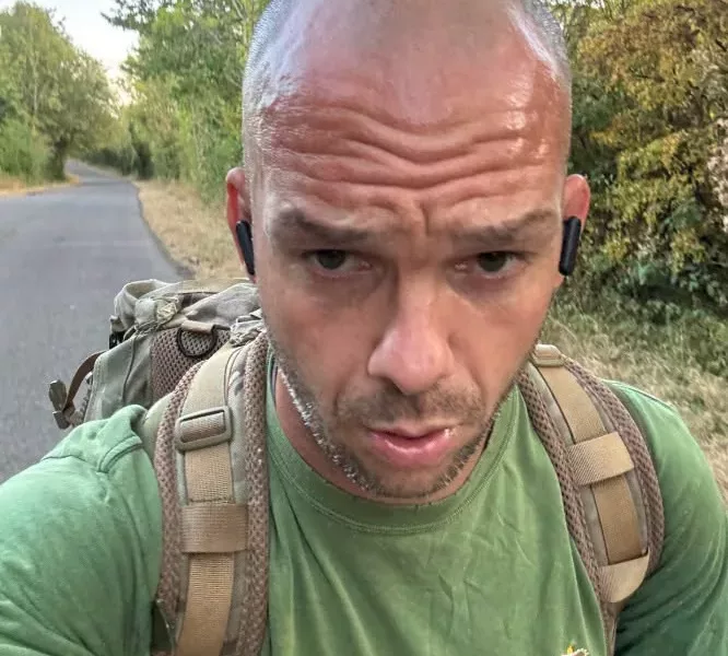 a man running wearing a rucksack