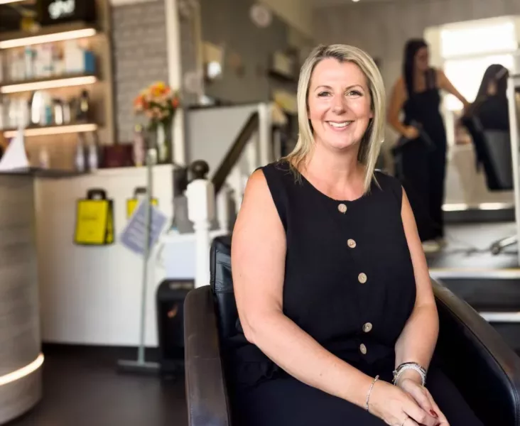 a woman sat in a hairdressers