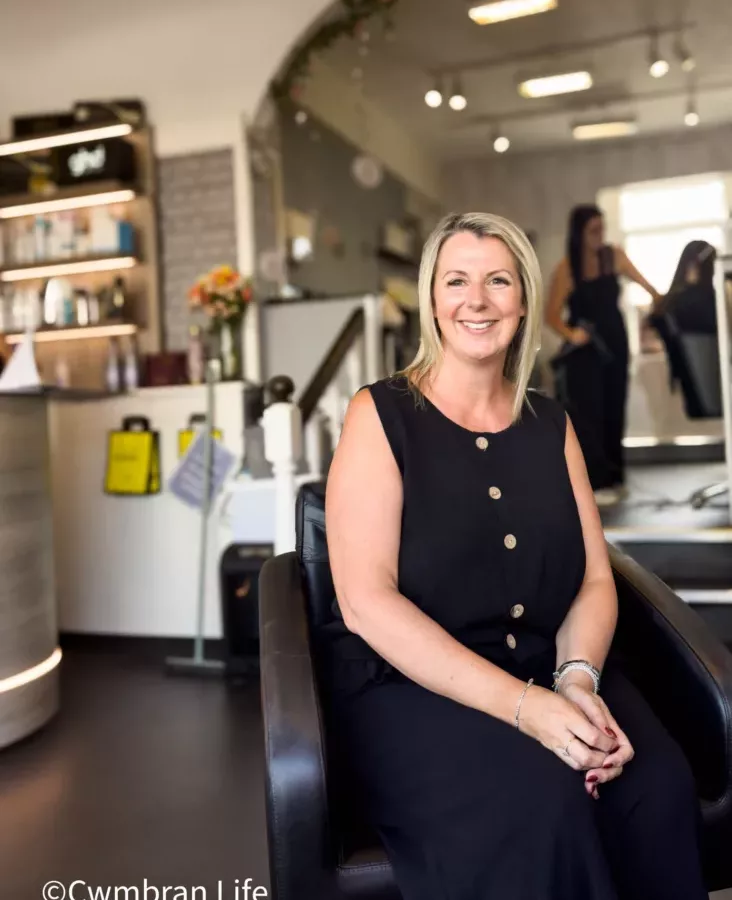 a woman sat in a hairdressers