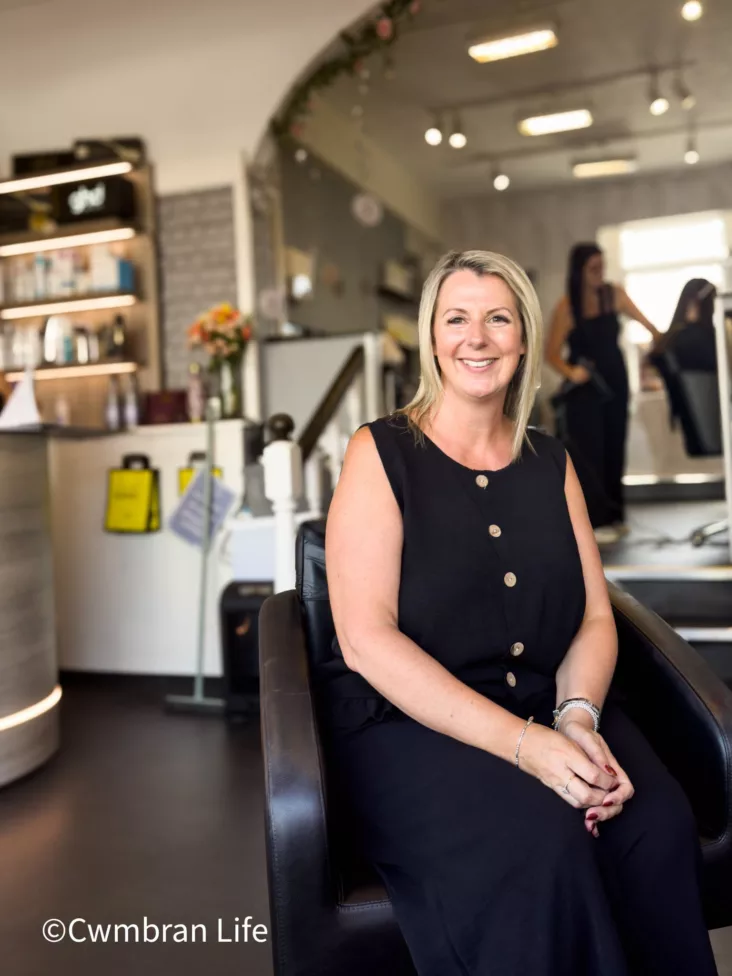 a woman sat in a hairdressers