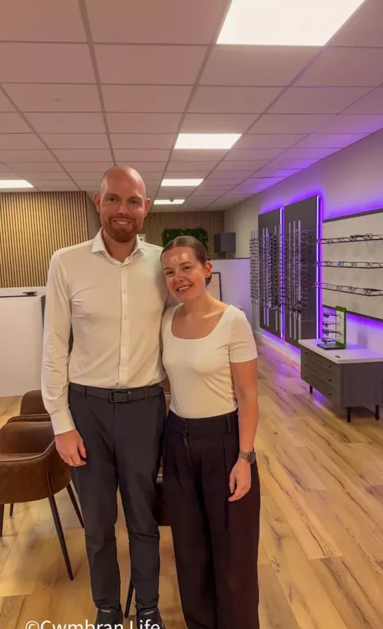 a man and woman in a an opticians