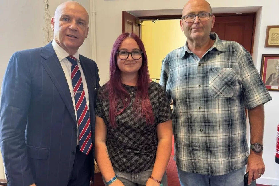two men and a woman