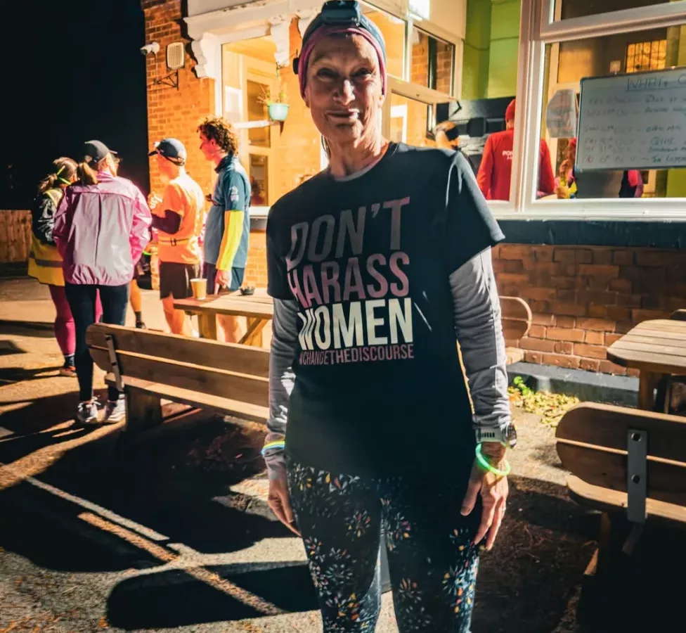 a woman wearing a t-shirt 'don't harass women'